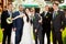 Bride stands together with funny groomsmen