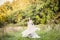 Bride twirling wedding dress in forest