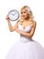 Bride with wall clock. beautiful blonde young woman waiting for the groom isolated
