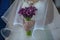 Bride wearing an opulent wedding dress with large tulle veil and holding a sophisticated plum calla lilies bridal bouquet