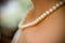 Bride wearing pearl necklace