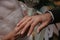 Bride wears gold wedding ring on the groom`s finger