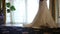 Bride wears a wedding dress in the morning. Bride in the room. Close up