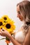 Bride in a wedding dress with a bouquet of sunflowers.Beautiful woman.Floristics