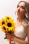 Bride in a wedding dress with a bouquet of sunflowers.Beautiful woman.Floristics