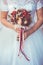 Bride in White Dress Holding Splendid Bridal Boquet