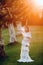 A bride in a white wedding dress with a belt in the Old town of Velden am werter see.A model in an Austrian wedding dress.Alps