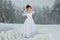 Bride in winter forest.