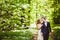 Bridegroom and bride in the spring forest