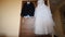 Bridegroom dress and bridal gown hanging