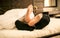 Brides feet in stockings and grooms\' in socks lying on bed