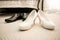 Brides and grooms shoes on floor at bedroom