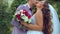 Brides kissing near medieval wall with ivy. slow motion handy camera motion style