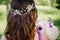 Bridesmaid with colorful wedding bouquet peonies and other flowers with professional makeup and crown tiara crest