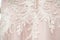 Bridesmaid dress lace. ace oneself up corset on white wedding dress, close up