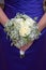 Bridesmaid holding a wedding bouquet