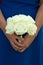 Bridesmaid holding white rose wedding bouquet