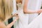 Bridesmaid makes bow-knot