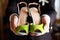 Bridesmaid\'s shoes green in the hands of groom