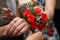 Bridesmaid wearing a beautiful bouquet in hand