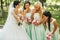 Bridesmaids admiring of bride