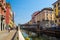 Bridge across water of Naviglio Grande canal waterway, Milan, Italy