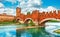 Bridge with archs Castelvecchio over river Adige