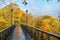 bridge with beautiful metal forging, in the park warm autumn in