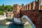 Bridge of Castelvecchio with arches over river Adige in Verona, Italy