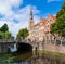 Bridge, church tower and houses Steenschuur canal in Leiden, Net