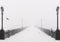Bridge city landscape in foggy snowy winter day
