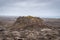 Bridge between continents in Iceland volcanic rock pushing upwards breaking apart small volcano