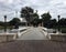 The bridge for cross the lake, female stucco roman style row stand on the bridge, Bang Pa In Royal Palace.