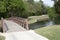 Bridge crosses a creek in a community park