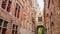 Bridge crossing between buildings over narrow Blinde-Ezelstraat, aka Blind donkey street, near Burg square, Bruges