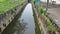 bridge crossing the outdoor concrete drainage system at the city street.