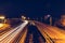 Bridge, curve road, night city landscape, freezelight car lights, long exposure,