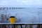 Bridge and dam across the Dnieper river on a cloudy day. Autumn dull landscape. Travel across Ukraine