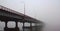 Bridge disappearing in the fog