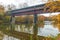 The Bridge of Dreams is a covered Bridge spanning over Mohican river in a fall season