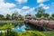 Bridge with flowers across the bay in a tropical garden