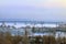 Bridge in fog over frozen river and passenger ships