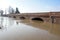 Bridge with full river . River is full . Bridge to cross the river that is flooding.