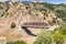 Bridge going over Coyote Creek in South San Francisco Bay Area, California; low water level visible due to existent drought