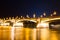 Bridge illuminated by lanterns in the evening in Budapest