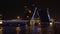 Bridge with illumination over the river at night