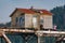 Bridge keeperâ€™s station atop the a swing span railroad bridge across the Siuslaw River near Florence, Oregon