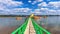 A bridge leading to the Buddha`s Footprint in the middle of the Mekong River in  Nakhon Phanom Province, Thailand