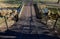 Bridge made of rusty lattice sheet metal. transparent sheet metal with a railing made of expanded metal over a small stream. wide