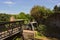 Bridge and old canal lock on the river Lee near Waltham Abbey ruins, UK